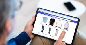 Person shopping on business website for clothing